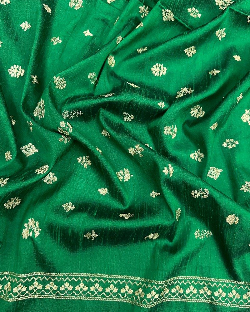 Vibrant emerald green raw silk fabric
